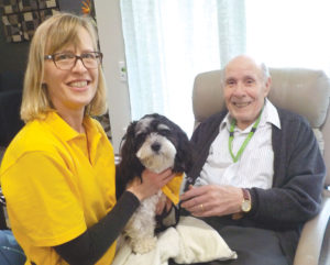 A visit from a furry friend makes everyone smile.